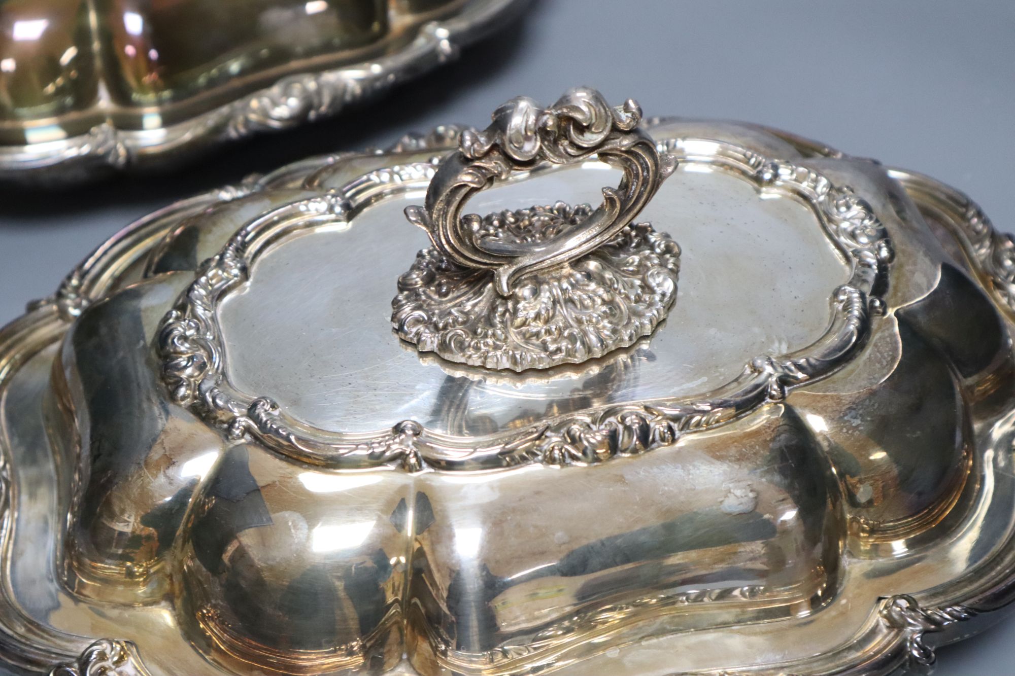 A pair of Victorian plated tureens and a plater sugar sifter
